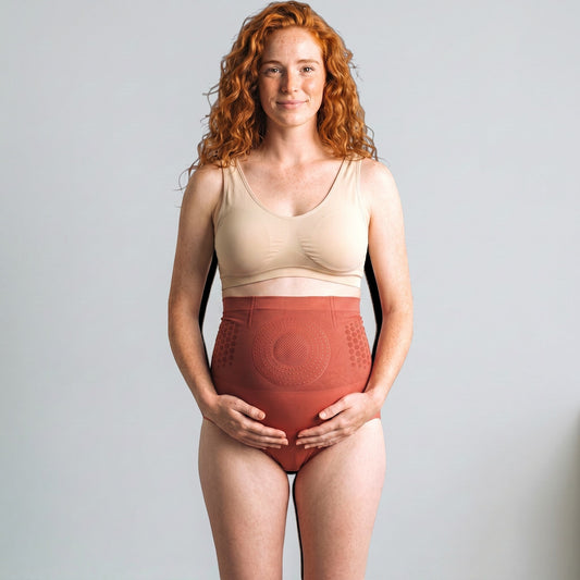 Brileh Shapewear high-waist seamless shaping briefs in terracotta worn by a woman with red hair
